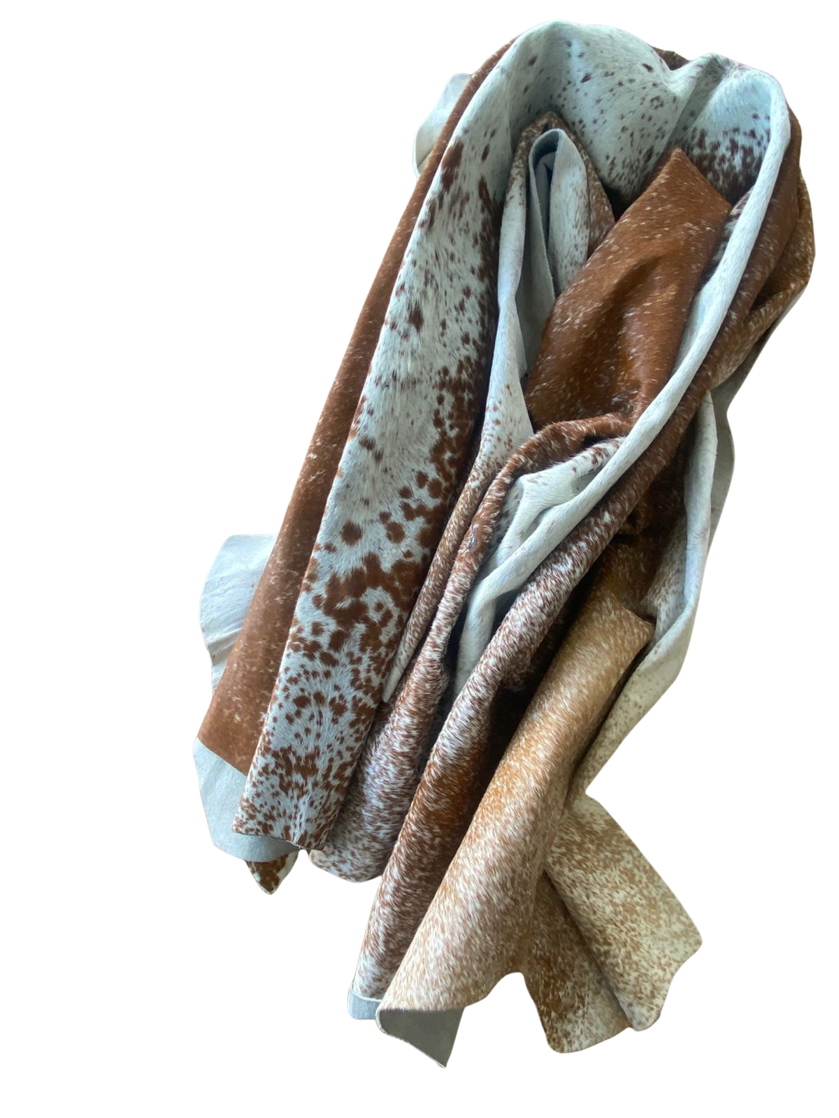 Folded brown, beige, and white COW HIDE
