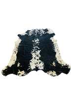 BLACK AND WHITE COW HIDE RUG
