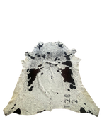 Cowhide rug with black and white pattern on a white background