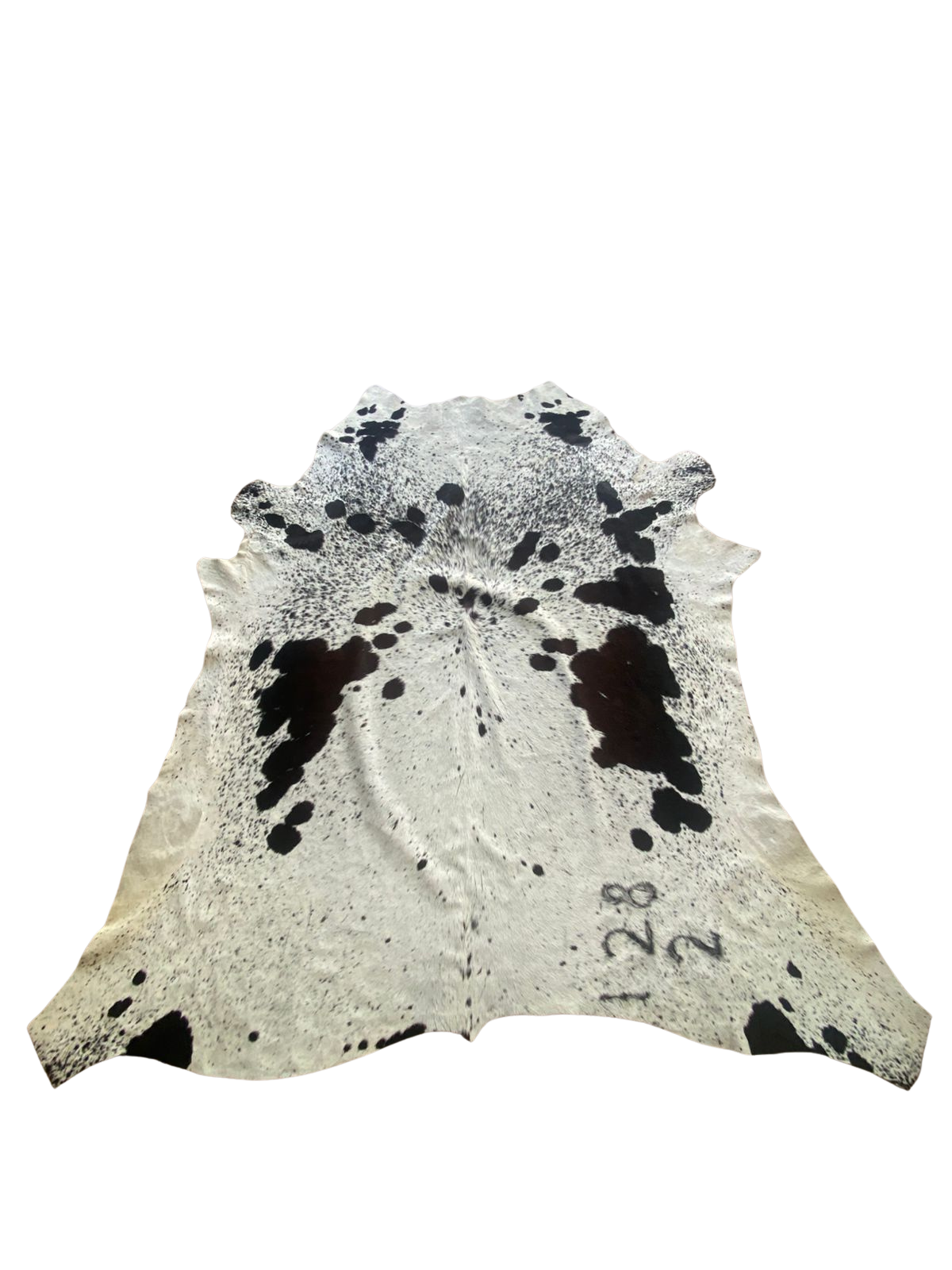 Cowhide rug with black and white pattern on a white background