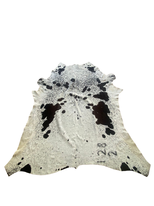 Cowhide rug with black and white pattern on a white background