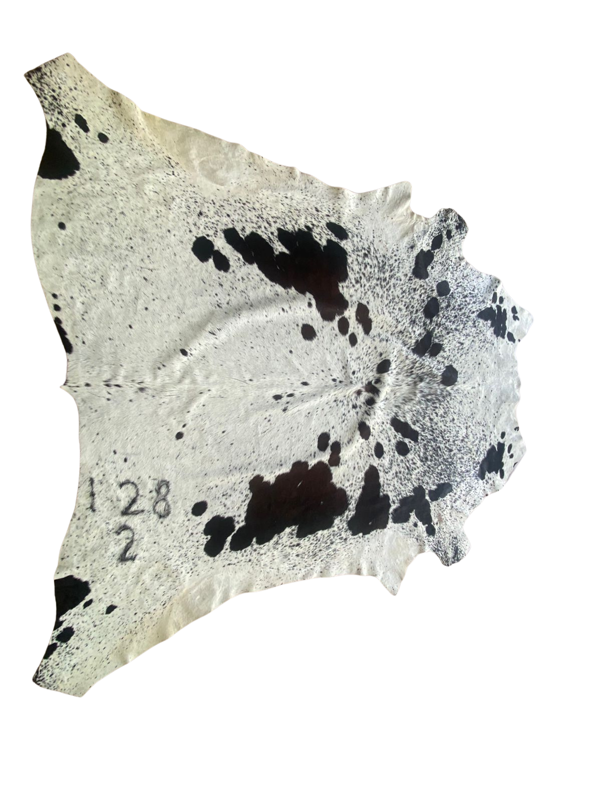 Cowhide with black spots on a white background