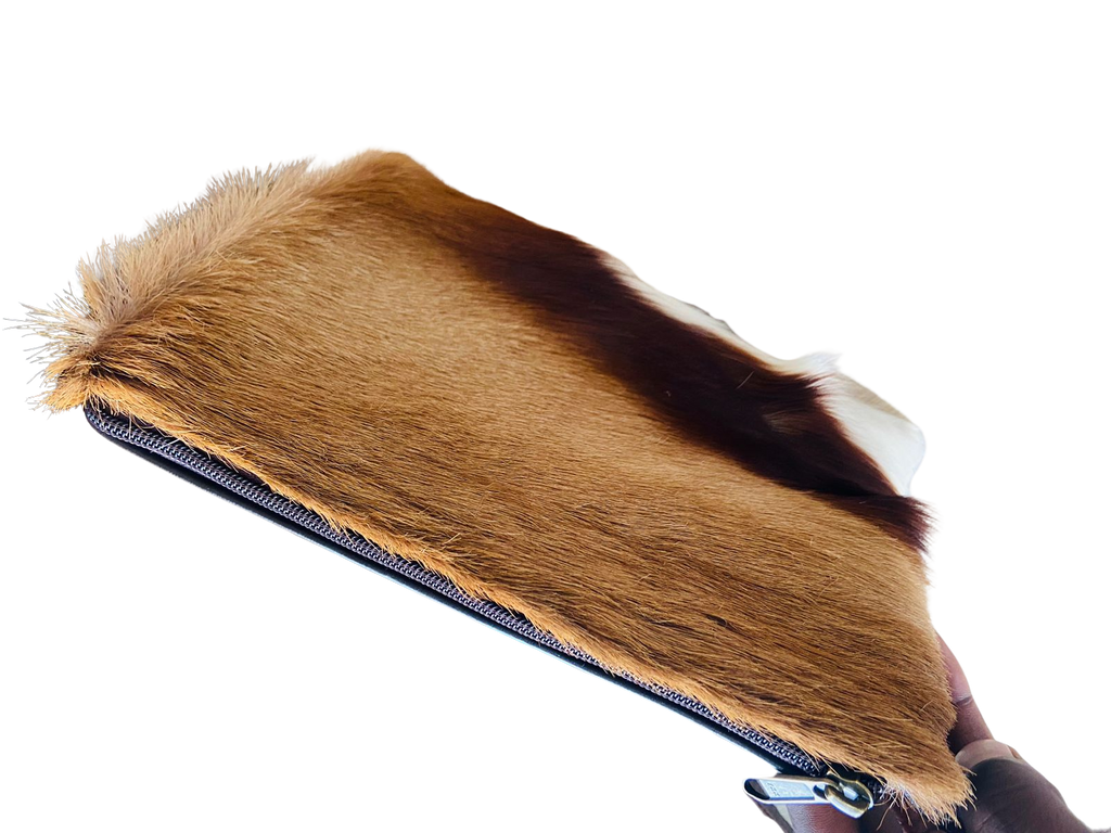 Fur-covered product with a zipper on a white background