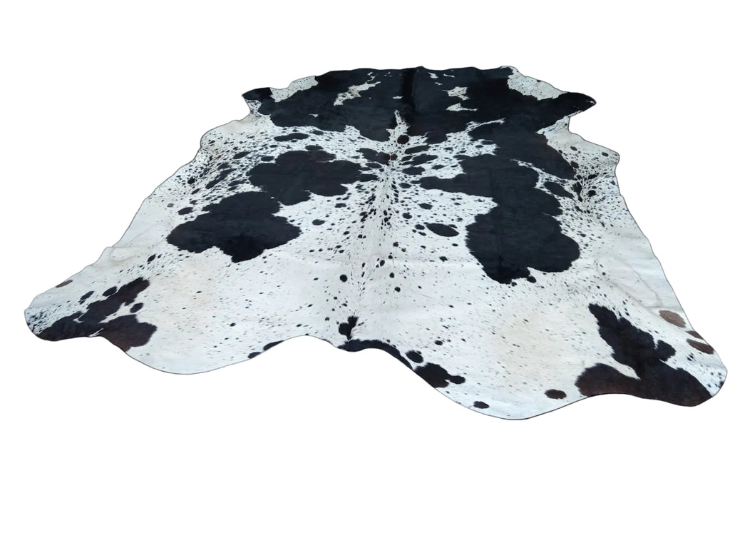 Cowhide rug with black and white pattern on a transparent background