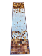 Patchwork cowhide rug with brown and beige squares 